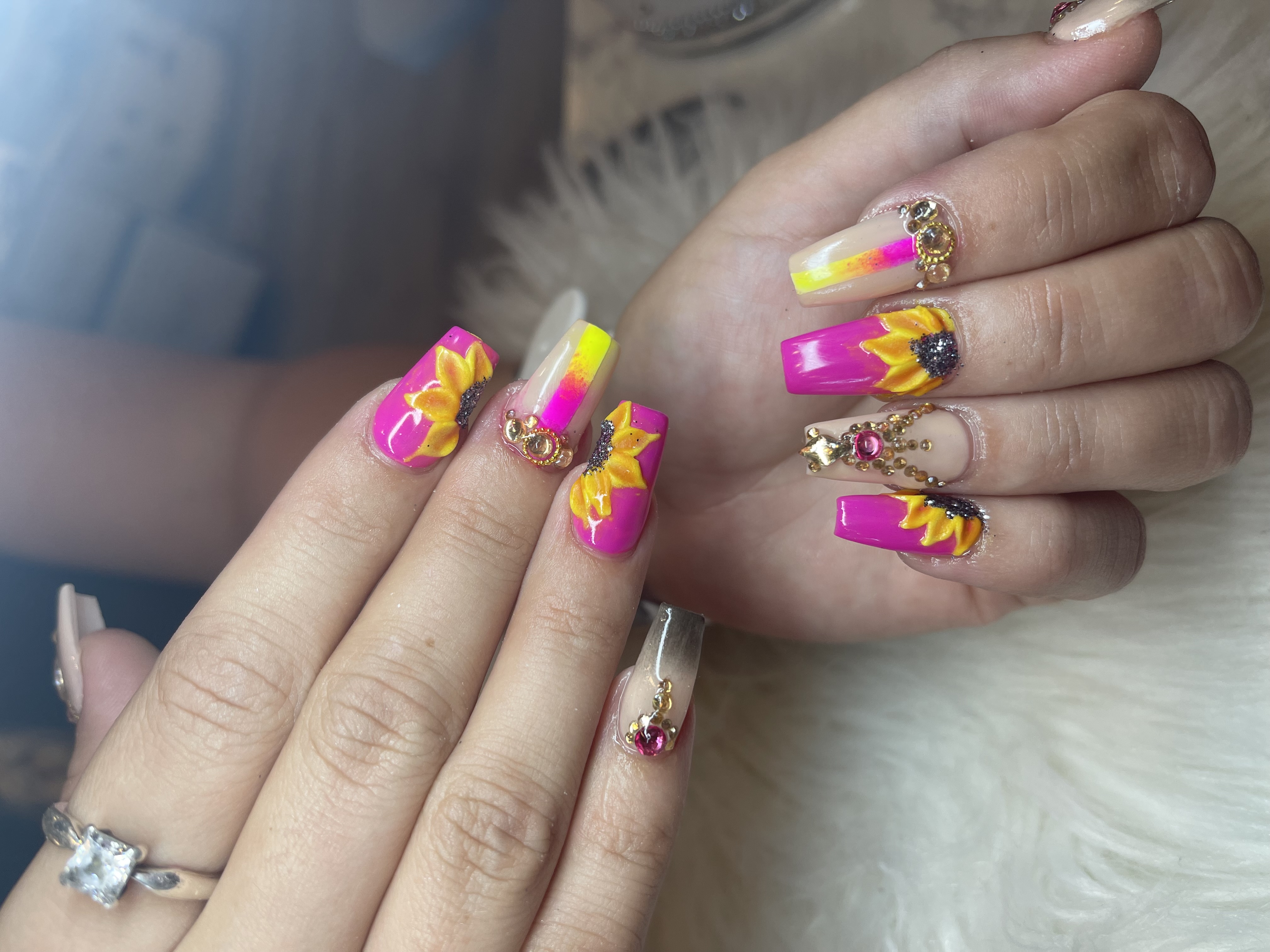 Hot pink and yellow 3D sunflower nail art with rhinestones